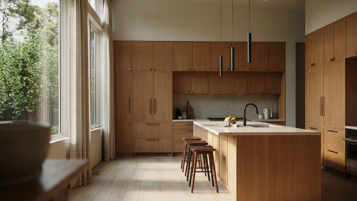 Warm wood cabinet kitchen with a pale porcelain island and black stools