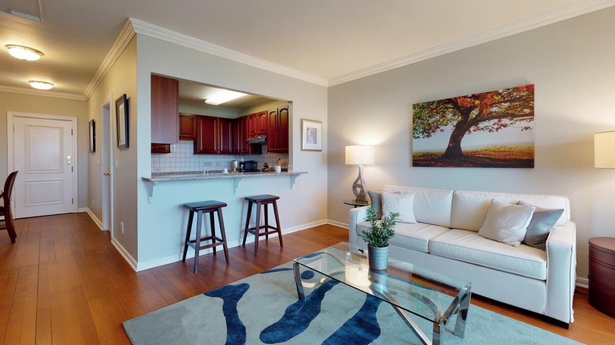 Apartment living room and kitchen connected by pass through window as breakfast bar in small space