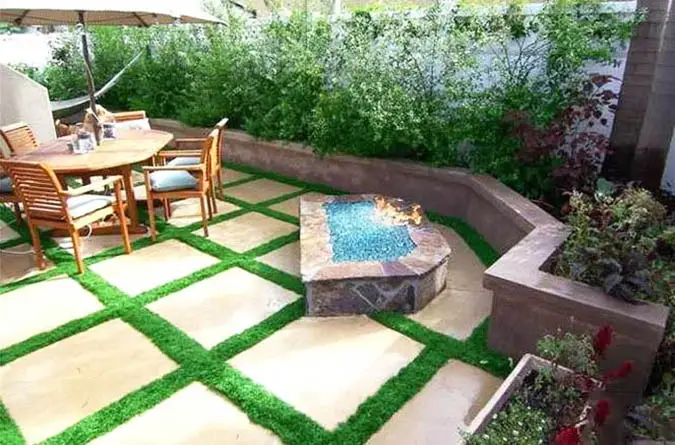 Artificial grass concrete patio steps with fire pit