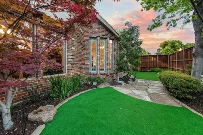Backyard landscaping with artificial grass