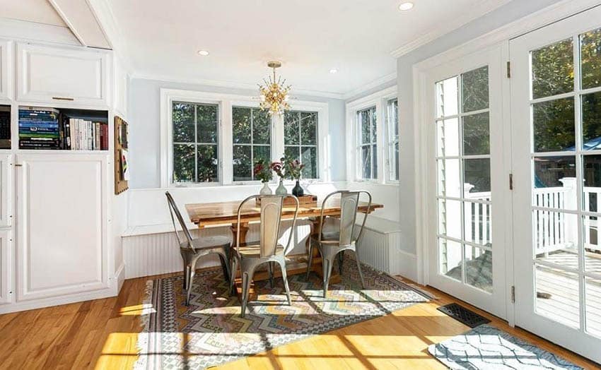 Bright breakfast nook with built in bench and wood dining table