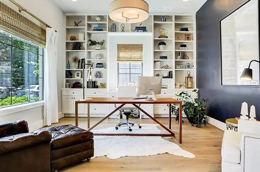 Office with custom cabinets with drawers and bookshelves