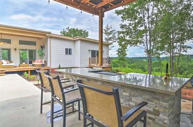 Covered outdoor kitchen with concrete countertop