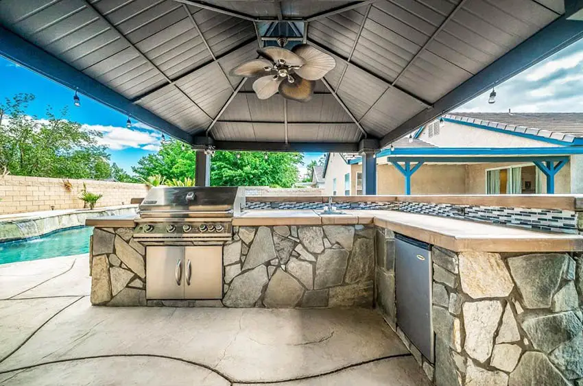 Covered outdoor kitchen with concrete countertops