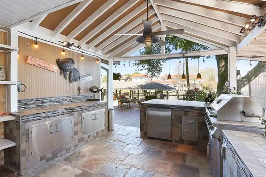 Covered outdoor kitchen with tile countertop