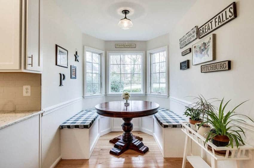 Dining room with built in breakfast nook bench picture windows