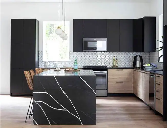 Kitchen with black and white quartz countertops