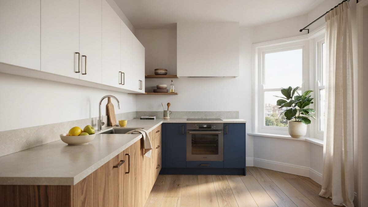 Potted plant sits on a corner window with three tone kitchen cabinets
