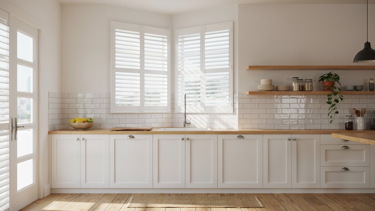 White plantation shutters tile backsplash and open shelves at corner windows