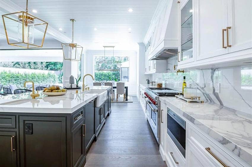 Kitchen with porcelain countertops white cabinets and dark brown island