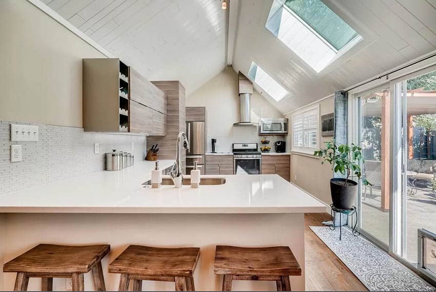 Kitchen with skylights and vaulted ceiling
