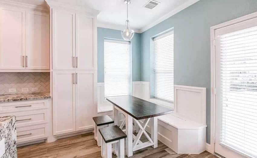 Kitchen with white shaker style built in breakfast nook