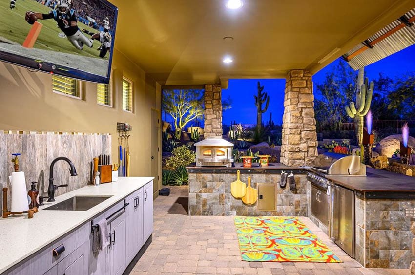 Outdoor kitchen with quartz countertops and slate countertops