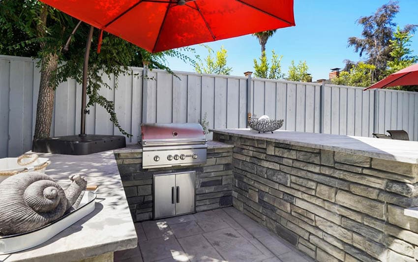 U shaped outdoor kitchen with concrete countertop