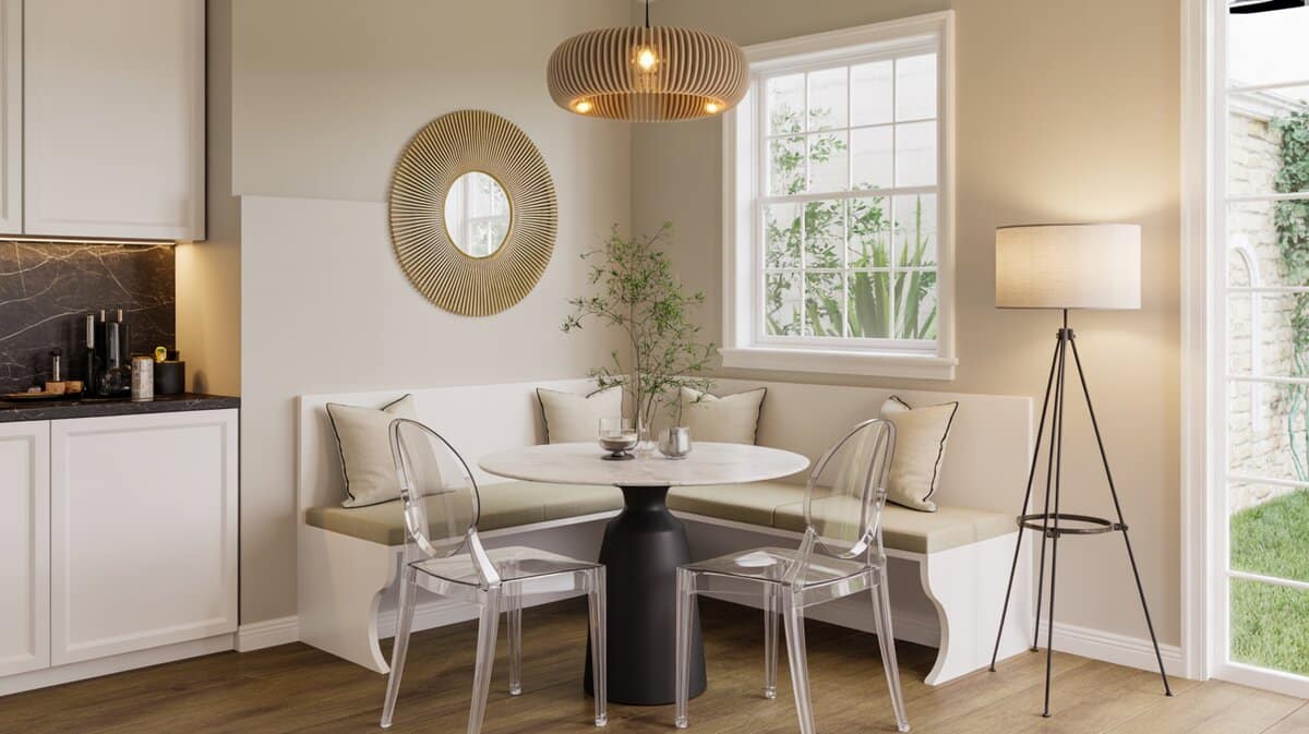 White breakfast nook corner bench with marble table and ghost chairs