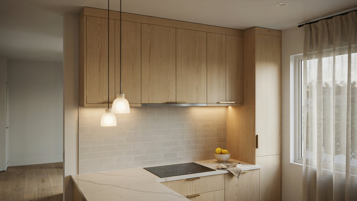 Contemporary kitchen with bleached wood cabinets and warm under cabinet lighting over white countertops