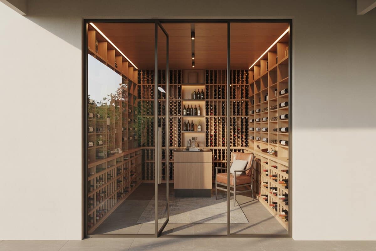 Glass-walled walk-in cellar with wood racks and a tan leather chair