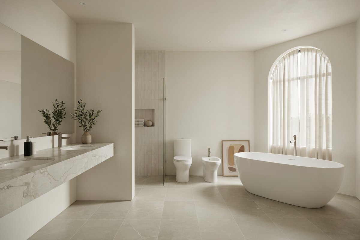 Spacious master bathroom with floating marble vanity, bidet, toilet, and freestanding tub