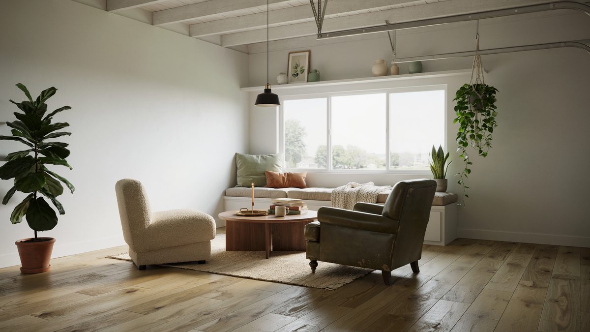 Converted garage lounge with sectional sofa, window seat, and potted plants