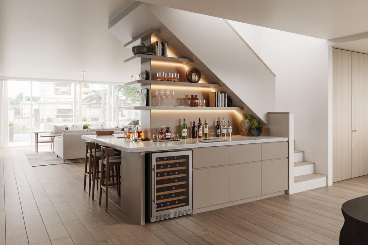 Under-stair bar with quartz counter and stainless wine fridge by living room