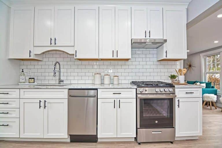 Top 5 Standard Stove Dimensions For Your Kitchen   Apartment Kitchen With Smaller Stove White Cabinets Subway Tile Backsplash 768x512 