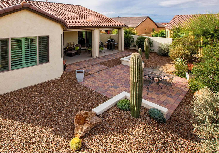 Backyard with desert landscaping and paver patio
