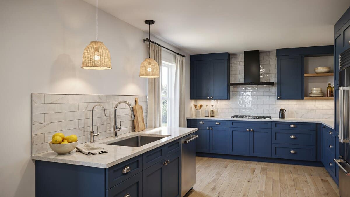 Kitchen with navy blue cabinets and streaked vein quartz countertops