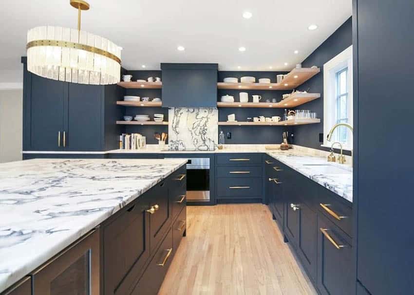 Contemporary kitchen with navy cabinets and streaked vein quartz countertops