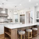 contemporary-kitchen-with-two-islands-wood-base-and-white-paint-base-quartz-counters