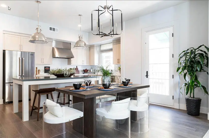 Contemporary open kitchen with quartz countertops and staged dining room