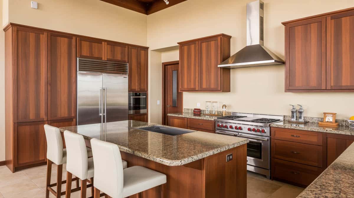 Kitchen with Calacatta quartz countertops and gray shaker style cabinets