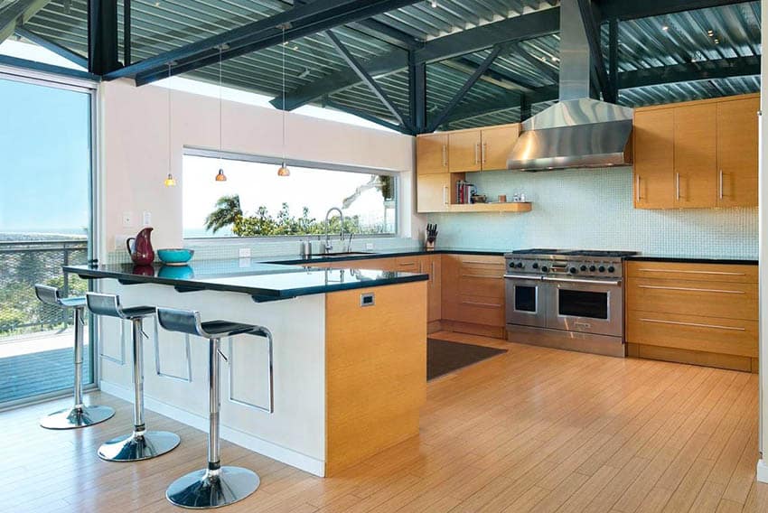 Kitchen with corrugated steel ceiling g shaped design
