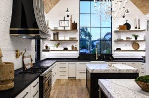 Modern Farmhouse Kitchen With White Cabinets Black Island And Quartz Countertops 300x199 