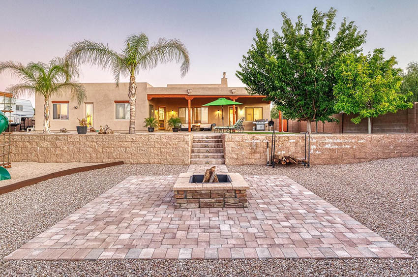 Paver patio with fire pit and gravel landscape