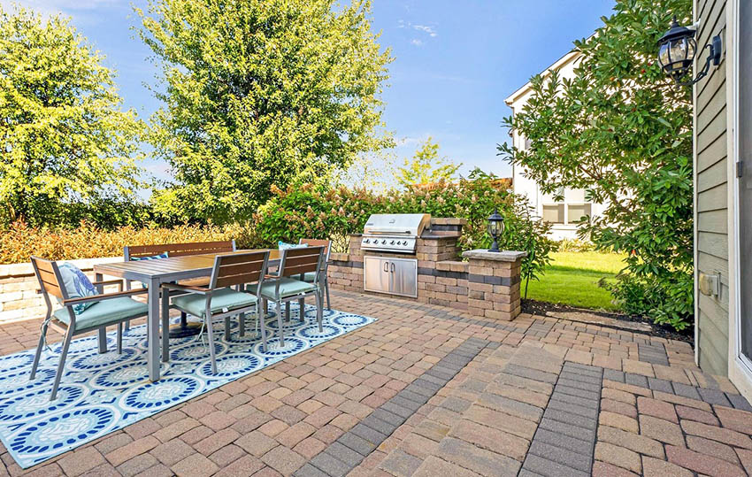 Paver patio with two colors and outdoor kitchen