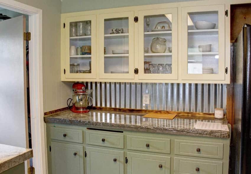 Small farmhouse kitchen with corrugated metal backsplash two tone cabinets