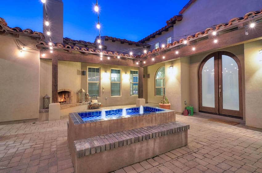 Spanish style paver patio with fountain