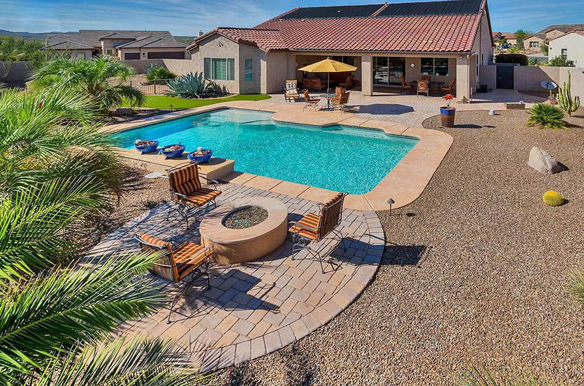 Swimming pool with paver patio and fire pit