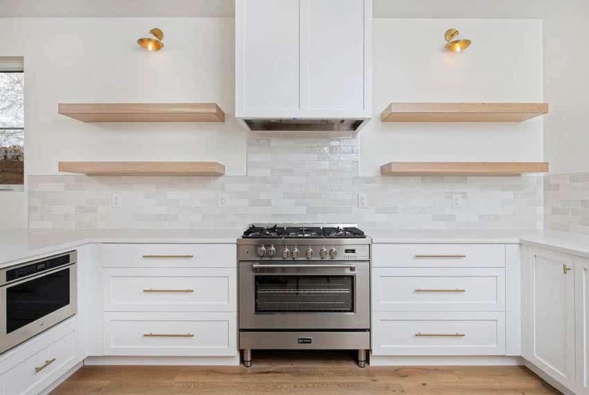 U shaped kitchen with center stove white cabinets white quartz countertops