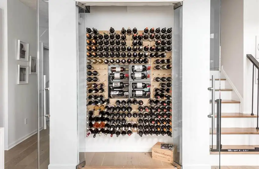 Under stairs wine closet with pivot doors