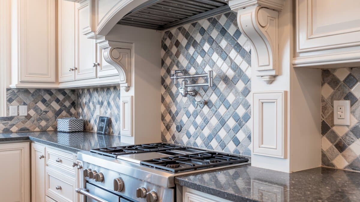 White kitchen detail showing diamond mosaic backsplash with gas range and ornate hood