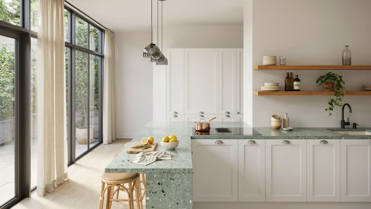 Seafoam recycled glass island, white shaker cabinets, floating oak shelves