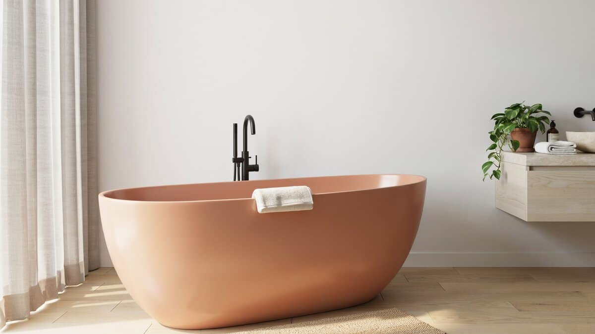 Acrylic faux copper tub with a smooth painted finish in a bright bathroom