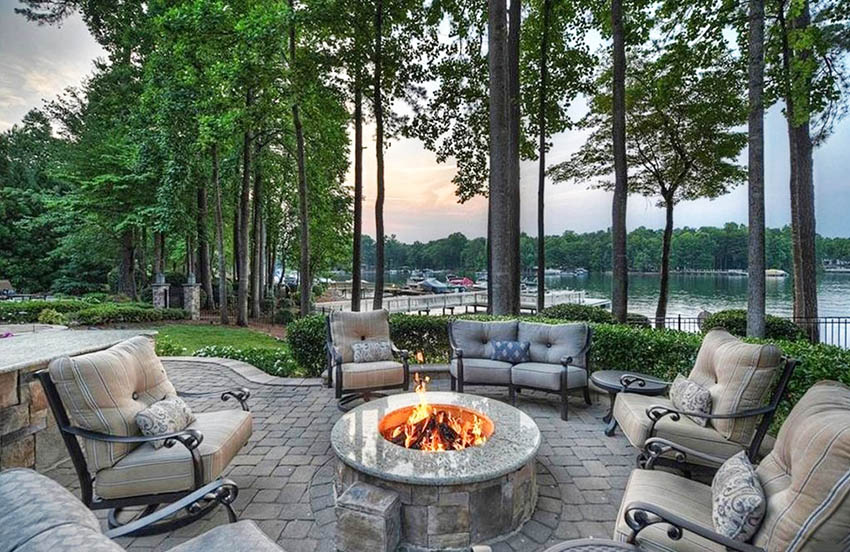 Amazing waterfront paver patio with fire pit
