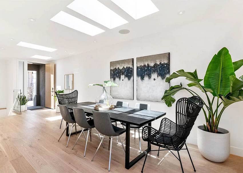Contemporary dining room with skylights