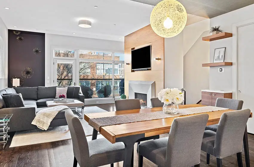 Contemporary dining room with staged table and globe lighting