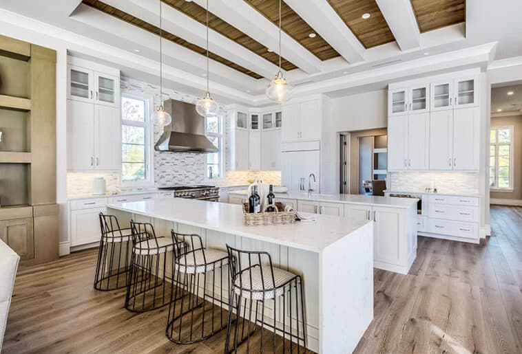 Contemporary Kitchen With Two Islands White Paint Base Tray Ceiling Quartz Counters Is 758x515 