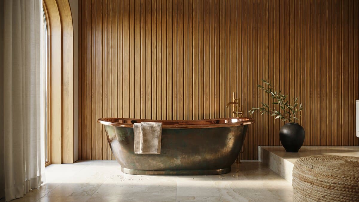 Custom copper bathtub showing a darker patina outside and polished copper inside