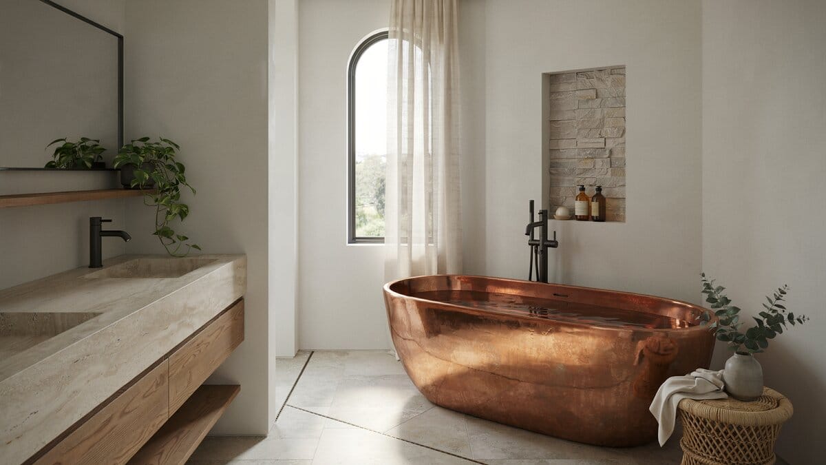 Deep copper soaking tub beside a stone vanity under a tall arched window