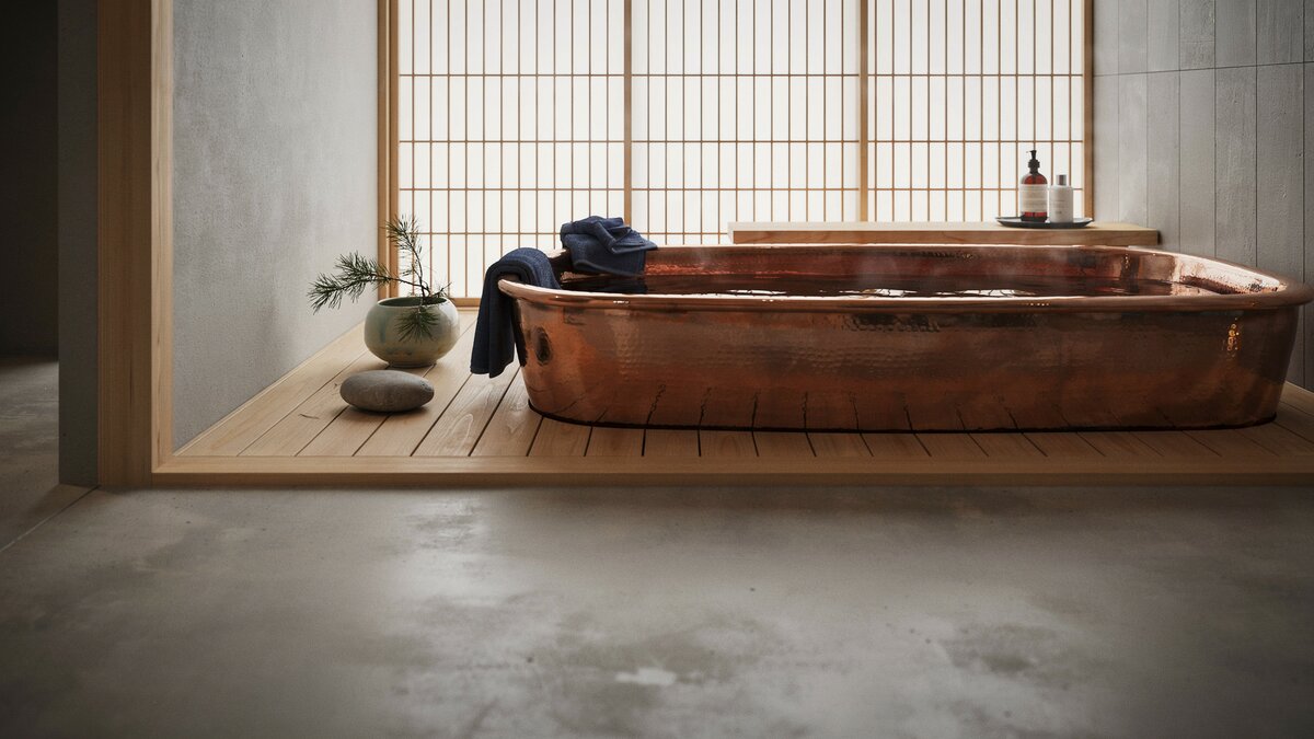 Rectangular copper soaking tub on a low wood platform behind shoji screens